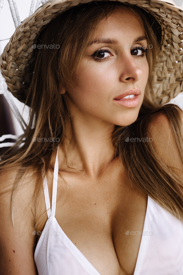 Close-up of woman wearing white bikini