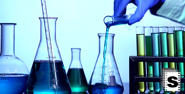 Scientist Mixing Liquids