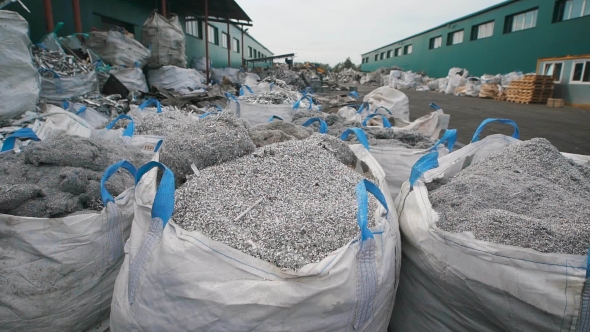 Huge Piles of Metal Chips on Special Storing Yard of Manufactory alt