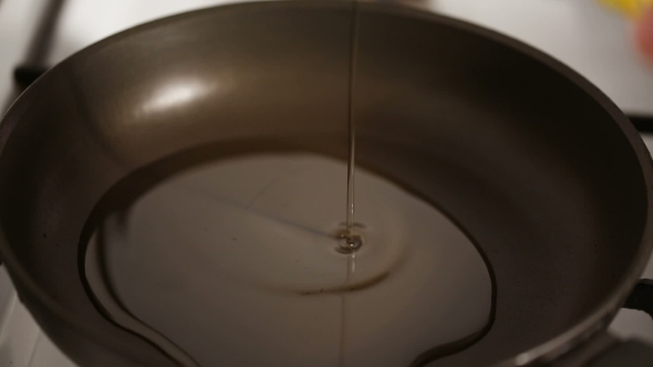 Pouring Oil in a Frying Pan