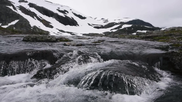 Typical Norwegian Landscape with Snowy Mountains