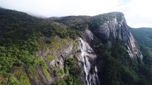 Aerial View in Motion of Mountains Waterfall on Adam Peak in Sri Lanka