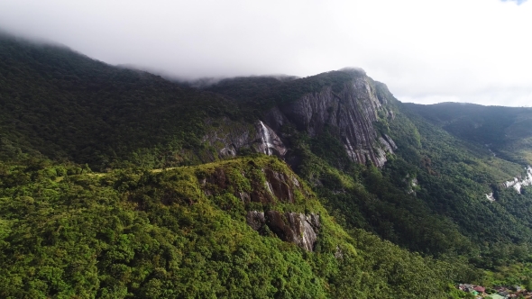 Aerial View of Waterfall in Sri Lanka at High Altitude Under the Clouds