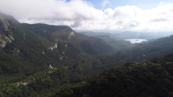 Aerial View in Motion of the Clouds and Valley in the Mountains on Adam's Peak in Sri Lanka