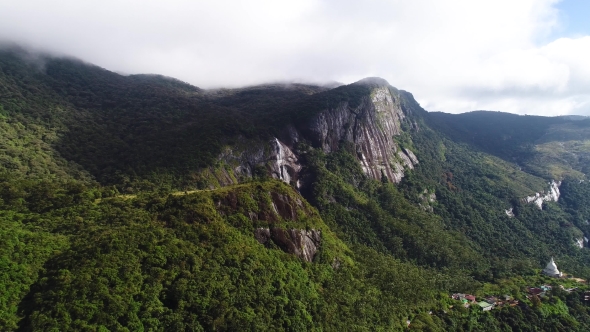Aerial View of Mountains, Forest and Waterfall Covered with Clouds on Adam's Peak in Sri Lanka
