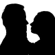 Kissing Couple in the Studio Is Worth It. Silhouette. White Background. - VideoHive Item for Sale