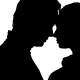 Kissing Couple in the Studio Is Worth It. Silhouette. White Background. - VideoHive Item for Sale