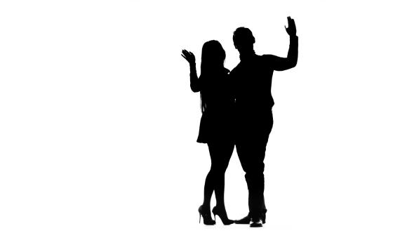 Couple in Love Is Waiting for Friends and Waving at Them. Silhouette ...