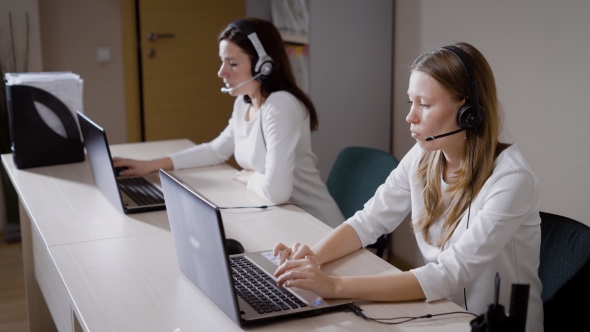 Several Women Print the Text on the Laptop Keyboard, the Ladies Talk on the Microphone alt