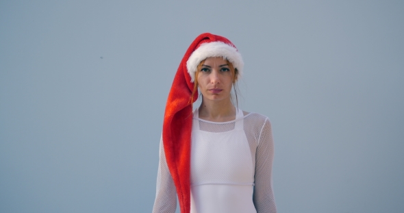 Young Woman in Christmas Hat in Swimsuit, Stock Footage | VideoHive