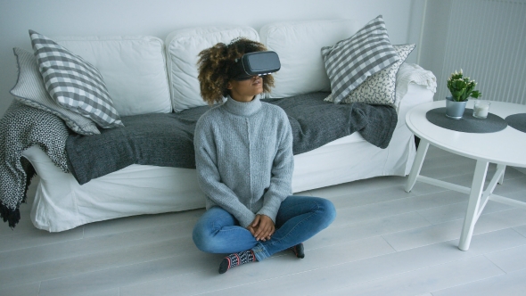 Woman in VR Glasses at Home alt