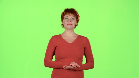 Woman in the Theater Claps Bravely To the Actors. Green Screen alt