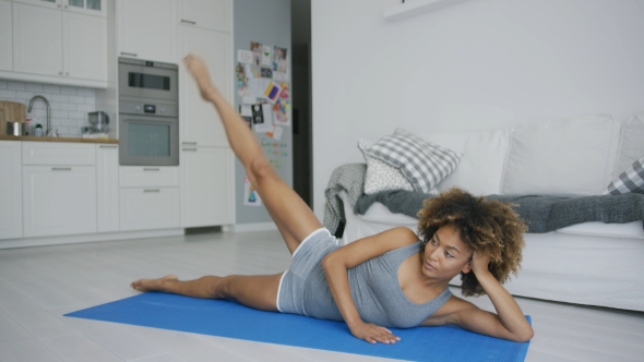 Concentrated Woman Training at Home alt