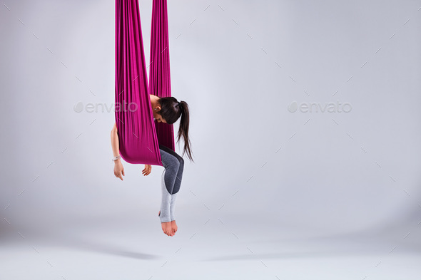 Aerial different inversion antigravity yoga in a hammock - Stock Photo - Images