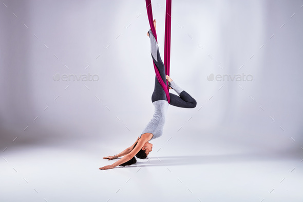 Aerial different inversion antigravity yoga in a hammock - Stock Photo - Images