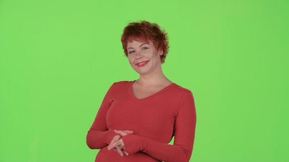 Woman Flirts and Winks with the Men. Green Screen alt