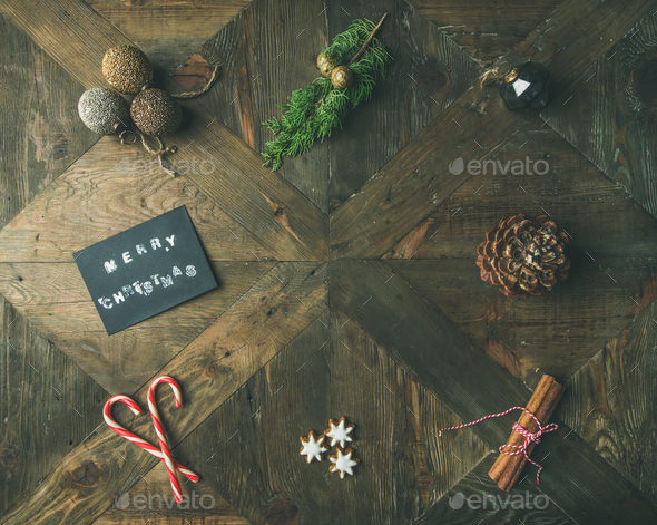 Flat-lay of greeting card, cinnamon, candy cane, top view - Stock Photo - Images