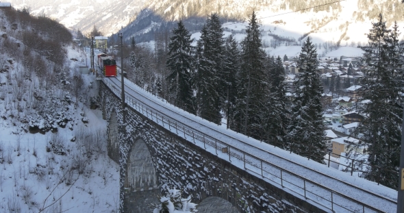 Train Passes the Bridge in the Mountains