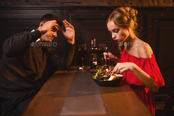 Quarrel of couple in restaurant, bad evening Stock Photo by NomadSoul1