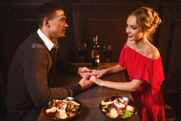 Love couple in restaurant, romantic evening Stock Photo by NomadSoul1