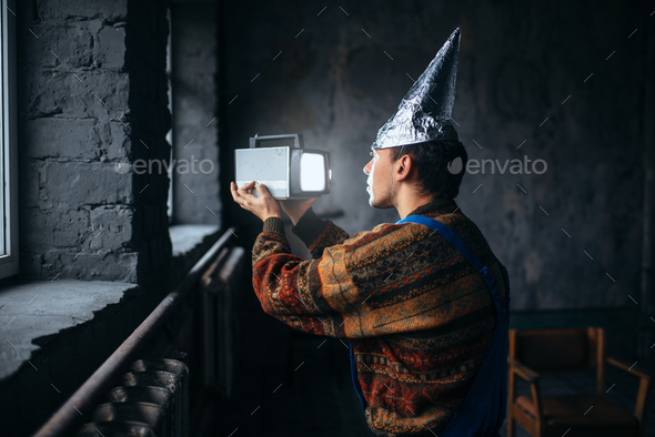 Paranoid man in tinfoil cap, mind protection, UFO Stock Photo by NomadSoul1