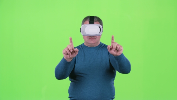 Man Is Looking at 3d Glasses. Green Screen alt