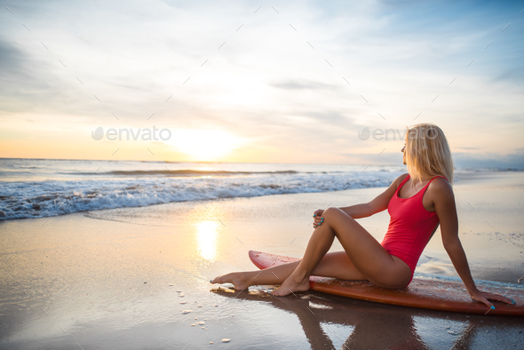 Woman with a surfboard - Stock Photo - Images