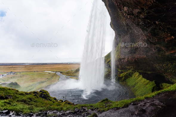 wet path around Seljalandsfoss waterfall - Stock Photo - Images