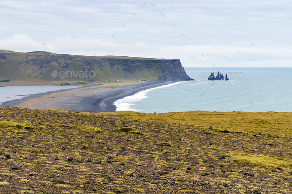view of Kirkjufjara black beach from Dyrholaey - Stock Photo - Images