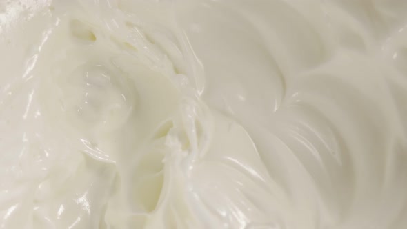 Whipped cream of egg whites texture close-up panning 4K 2160p UltraHD footage - Beaten egg whites st