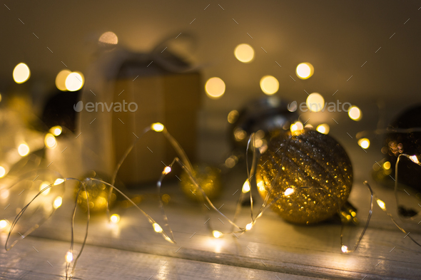 Christmas decoration with fir tree, gift box, garland lights, toys. Winter holidays, Merry Christmas