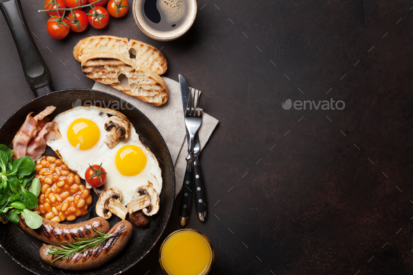 English breakfast. Fried eggs, sausages, bacon - Stock Photo - Images