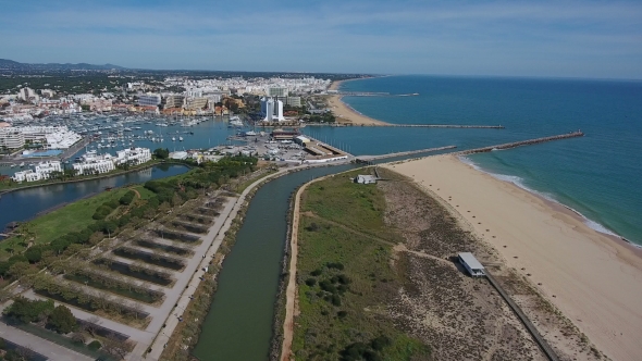Aerial. Shooting a Video From the Sky with the Drone of a Tourist Town Vilamoura. Algarve alt