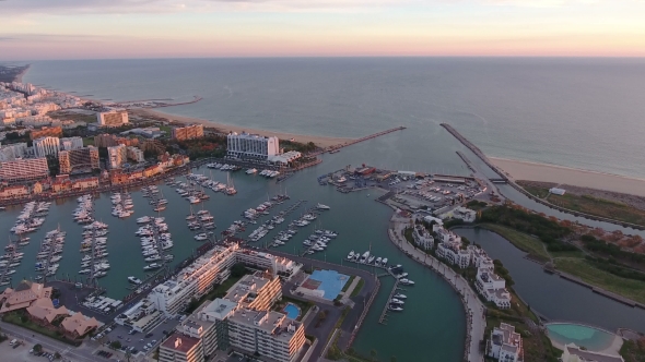 Aerial. Tourist Town of Vilamoura and the Port with Yachts, Filmed From Air. Portugal alt