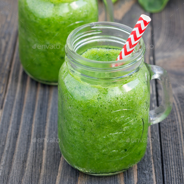 Green smoothie with celery, cucumber, spinach, apple and lemon, square