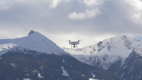 White Drone in the Snowy Mountains