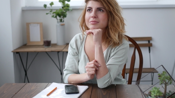 Thinking Beautiful Woman at Home