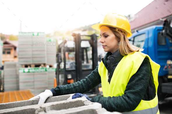 Young woman worker in an industrial area. - Stock Photo - Images