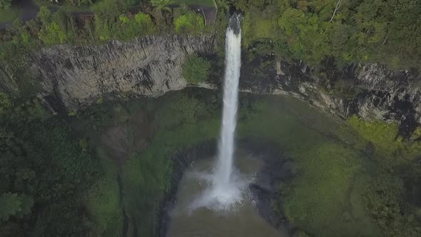 Scenic aerial footage of waterfall in New Zealand