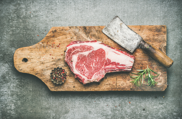 Meat high-protein dinner concept with raw beef steak rib-eye - Stock Photo - Images