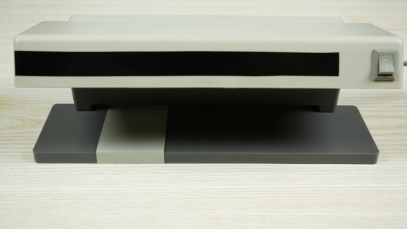 A Few Euro Notes in Hand. Check on the Currency Detector alt