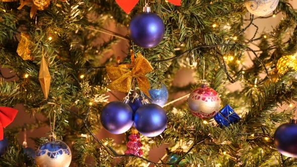 Christmas Decoration on a Tree with Blinking Garlands alt