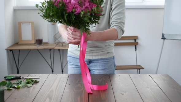 Florist Prepares a Bouquet of Flowers for Sale