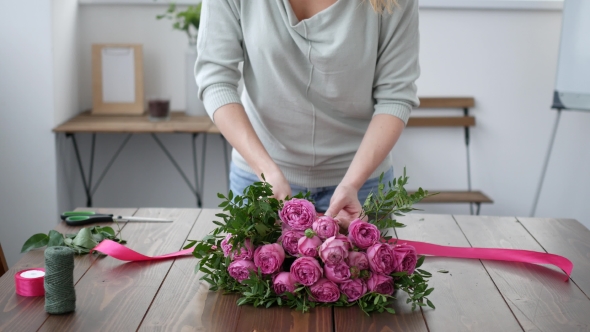 Florist Prepares a Bouquet of Flowers for Sale