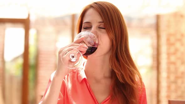 Young woman drink wine in cafe