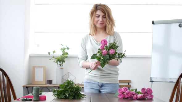 Woman Florist Makes Flower Bouquet