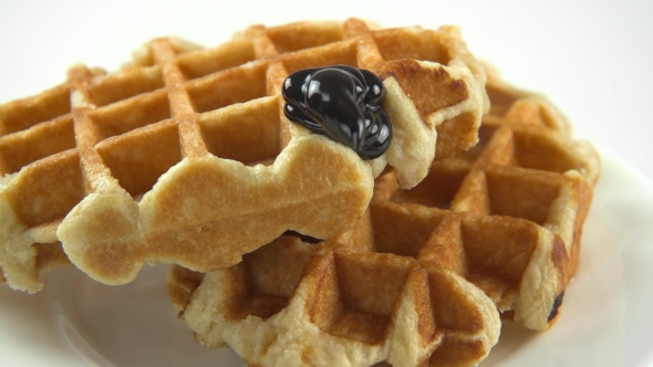 Chocolate Sauce Flows on Waffles