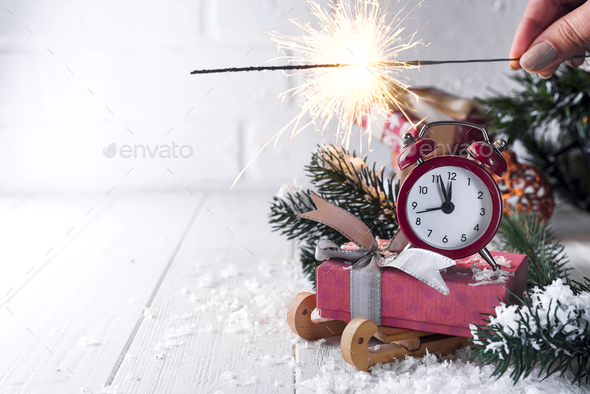 New Year's clock with burning Bengal fire - Stock Photo - Images