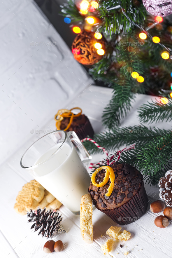 Cookie with milk, muffin, cookies and christmas tree - Stock Photo - Images