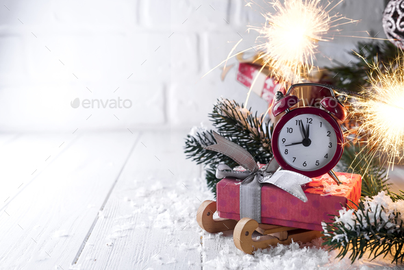 New Year's clock with burning Bengal fire - Stock Photo - Images